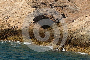 rough and rocky shore line of kalymnos Island Greece