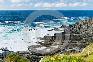 Rough and rocky shore at Malin Head, Ireland\'s northernmost point, Wild Atlantic Way, spectacular coastal route.