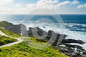 Rough and rocky shore at Malin Head, Ireland\'s northernmost point, Wild Atlantic Way, spectacular coastal route.