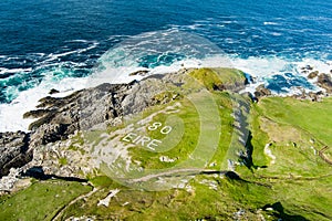 Rough and rocky shore at Malin Head, Ireland\'s northernmost point, Wild Atlantic Way, spectacular coastal route.