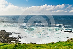 Rough and rocky shore at Malin Head, Ireland\'s northernmost point, Wild Atlantic Way, spectacular coastal route. Numerous