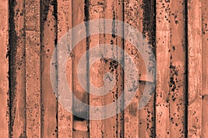 rough and rusty orange grayish orangish corrugated iron metal surface close-up