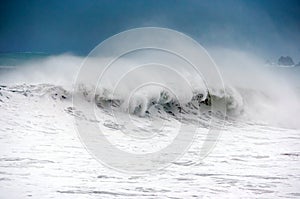 Rough sea with big wave breaking photo