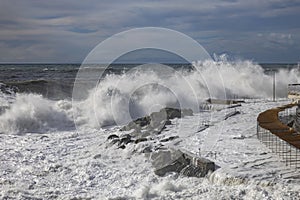 Rough sea with big waves on the piers of the Genoa seafront, Italy