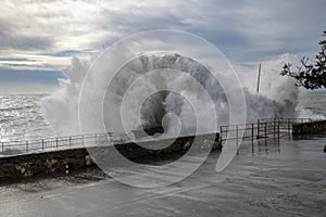 Rough sea with big waves on the piers of the Genoa seafront, Italy