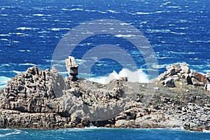 Rough sea and furious waves smack into the rocks at the beach of Santa Teresa di Gallura, Sardinia, Italy.