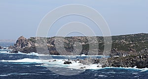 Rough sea and furious waves smack into the rocks at the beach of Santa Teresa di Gallura, Sardinia, Italy.