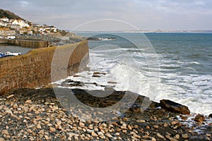 Rough sea outside Cornish harbour