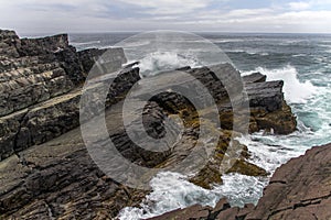 Rough seas and layered rocks at Mistaken Point