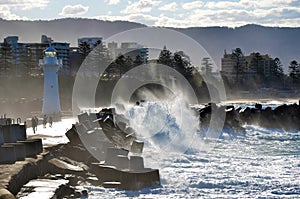 Rough seas near lighthouse breakwall photo