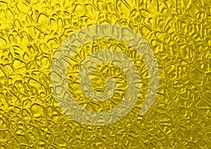 Rough shining golden yellow metallic texture background with organic shapes