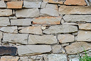 Rough stone masonry. Fragment of a wall