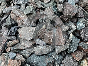 Rough stones, crushed stone, granite gravel close-up