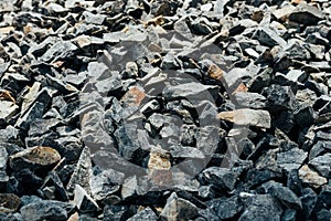 Rough stones, crushed stone, granite gravel close-up. Building material background