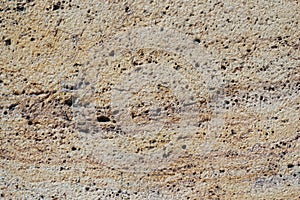 Rough surface of an eroded travertine marble stone