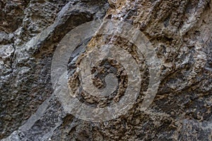 Rough surface of a stone wall close-up