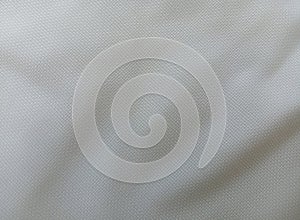 rough texture of the surface of the white or ivory wavy cloth