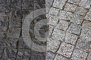 Rough texture of wet block pavement, Saint Malo old side-street