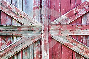 Rough textures closeup of barn door with peeling paint