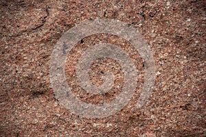 Rough uneven red stone wall