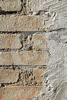 Rough, uneven surface. Cement plaster on a brick wall, texture, background. Old, sloppy, careless brickwork