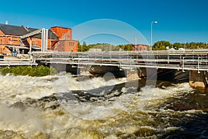 Rough waters of bypass on rapids Kuusankoski, Finland