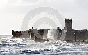 Rough waves around Castle of San Sebastian, Cadiz