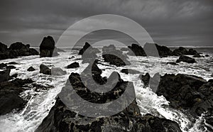 Rough waves crashing against coastline photo