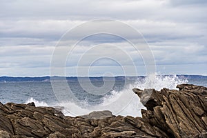 Rough waves crashing against the rocks at Vivonne Bay Rock Pool