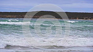 Rough waves crashing onto the beach on Kangaroo Island, South Australia