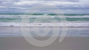 Rough waves crashing onto the beach on Kangaroo Island, South Australia