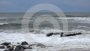 Rough waves splash on rock