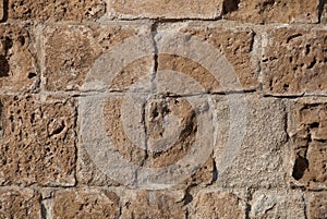 Rough weathered sandstone surface texture close up