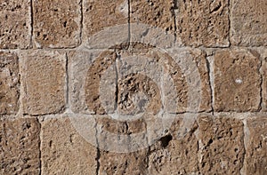 Rough weathered sandstone surface texture close up