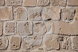 Rough weathered sandstone surface texture close up