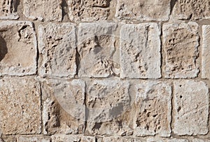 Rough weathered sandstone surface texture close up