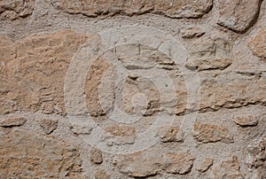 Rough weathered sandstone surface texture close up