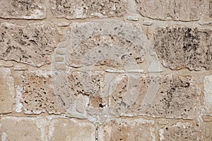 Rough weathered sandstone surface texture close up