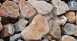 Rough weathered stone wall surface texture close up