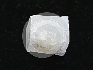 rough white calcite stone on dark background