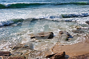 Pacific Ocean Waves on Cronulla Beach Rocks and Sand, Sydney, Australia photo