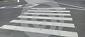 Rough white lines on zebra crossing at intersection