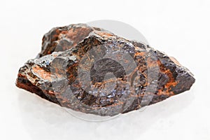 rough Wolframite stone (tungsten ore) on white