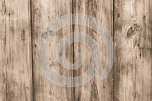 The rough wooden surface of table. Dirty and shabby wooden boards. Old wood plank texture background. Light brown wooden fence, pa
