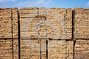 Rough 2x4 spruce and pine SPF lumber piled at a sawmill photo