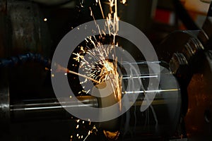 Roughing with a grinding abrasive wheel on a cylindrical grinder with sparks