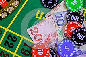 Roulette casino table is with Georgian banknotes, lari, a poker chips.