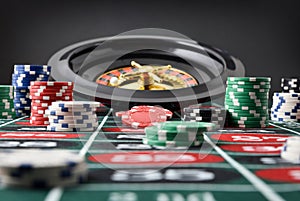 Roulette game table with chips with isolated black background