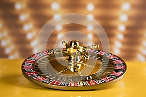 Roulette wheel in motion in a casino background