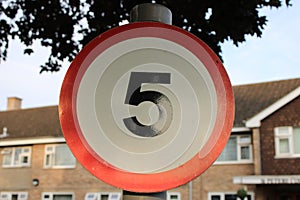 Round 5 MPH speed limit sign up close UK